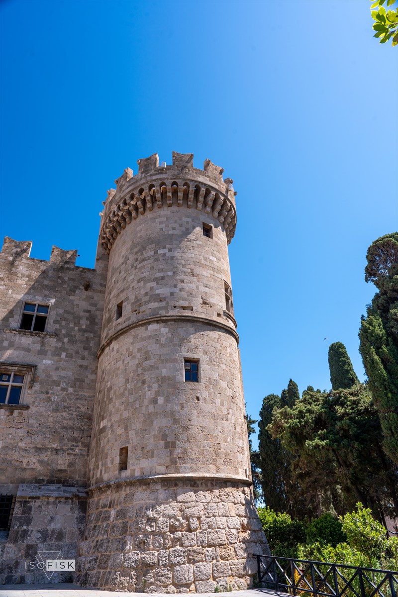 Historic round stone tower against a clear blue sky