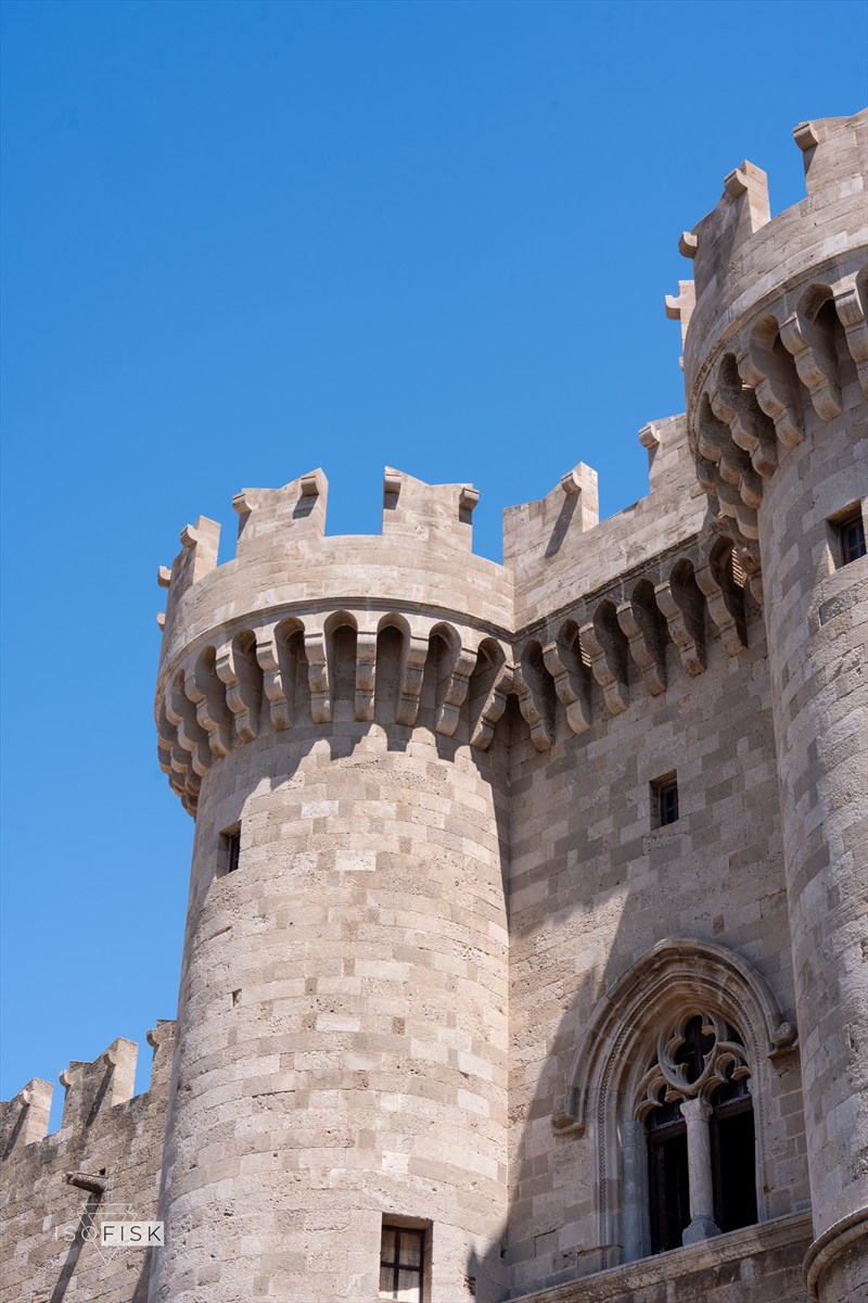 Close view of a round stone castle tower