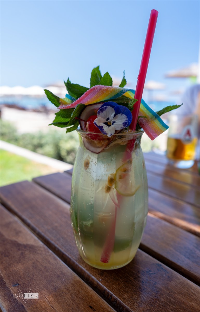 Colourful cocktail on a table by the sea